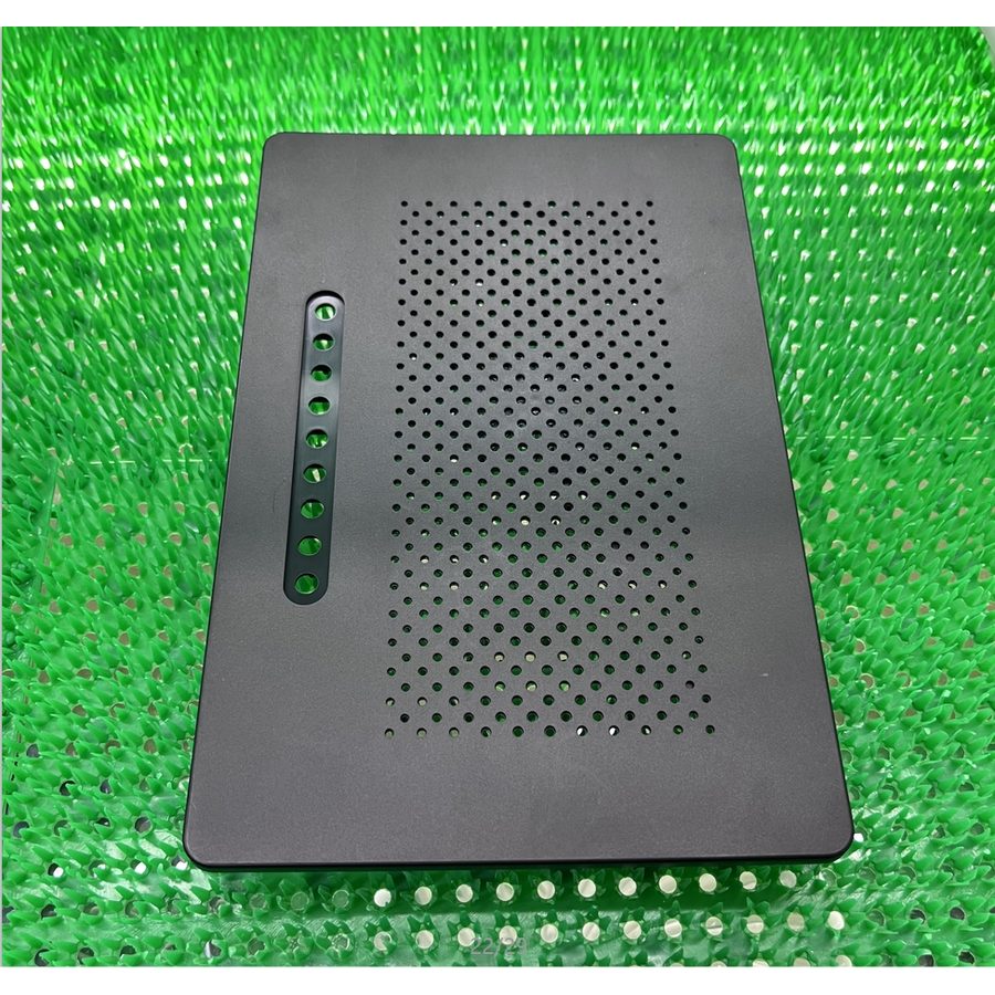 Grey perforated moulded plastic panel with a regular array of holes