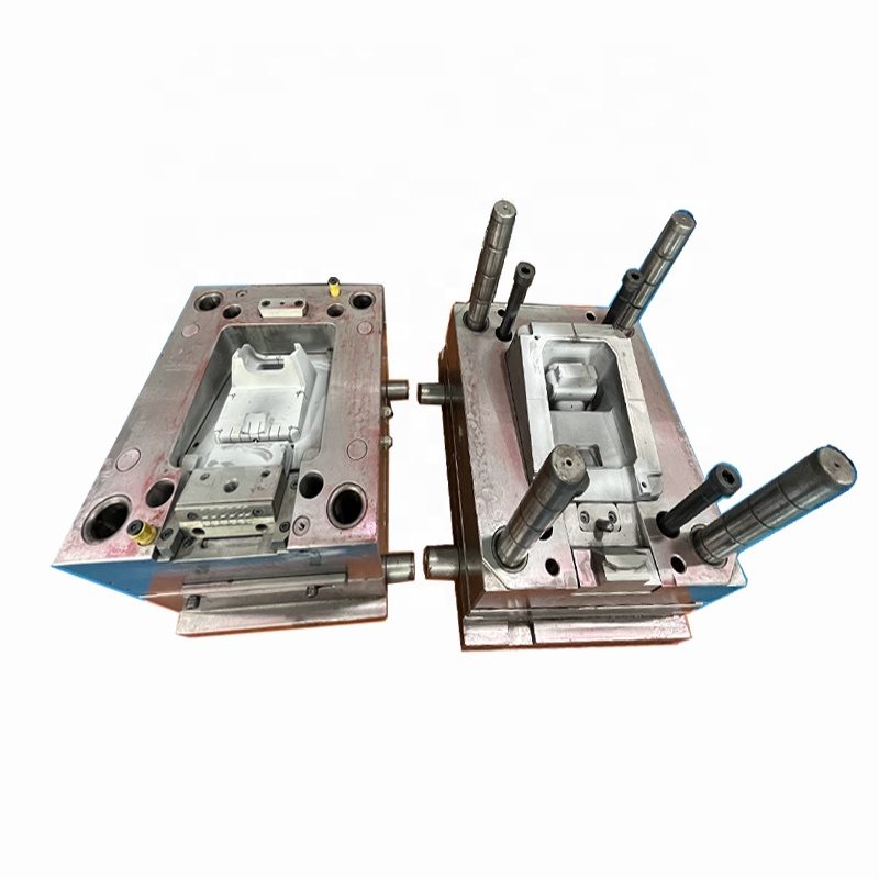 Two-plate injection mold opened to show mirror polished cavity and core inserts