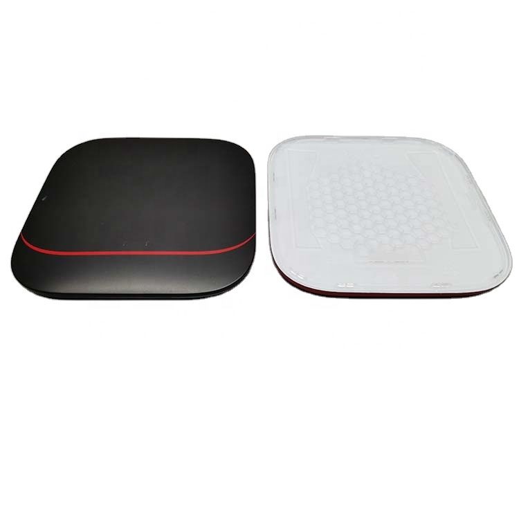 Black moulded router or set-top box case with a red trim detail and mesh panel