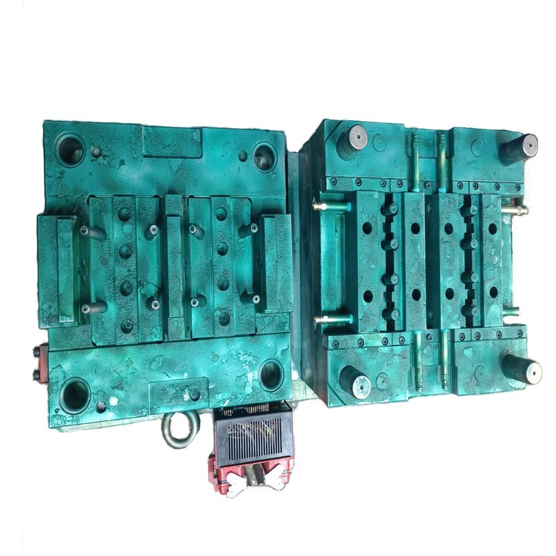 Injection mold with side-action slides shown open on the toolroom bench